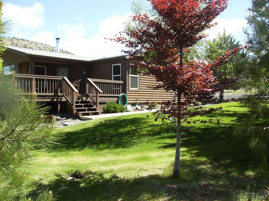 Beautiful 3 bedroom, 2 bath home with wonderful decks to take in the sunrise and the sunsets like none other. The home features tile floors, beautiful custom tile bathrooms, open floor plan, solid wood doors and all windows framed in wood. This is in a quiet peaceful and private setting with mature trees and easy care landscaping. Entire property is fenced and cross-fenced with no-climb, treated horse fencing. Fencing alone cost $25,000!