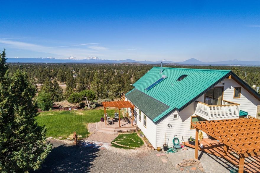 You will love this glass prow front frame home on 5-acre rim lot, w/panoramic Cascade views enjoyed from living spaces or the loft style master bedroom. What was once a sunroom is now the perfect music room, exercise room or TV room. The kitchen is large, w/kitchen island, built-in microwave, dishwasher, trash compactor & solid surface counters! Very open den/office. Entire home has been updated, including fully finished basement, with mechanical room. 2-car detached garage, RV Ramada & landscaping.