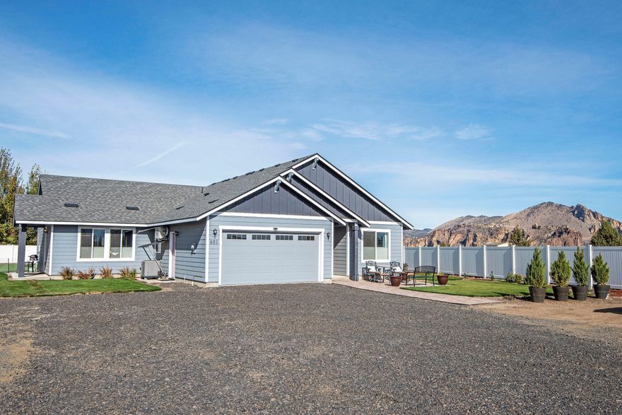 Amazing views of Smith Rocks from this almost new 2018 built home on .51 acres!  Laminate flooring, stainless appliances, quartz counters, soft close cabinetry and 4 bedrooms with 3 baths.  The sunlight pours in to the large windows and vaulted ceilings of the open living area.  The attached 4th bedroom is set up as a mother-in-law/guest unit of 512 sq ft with a separate entrance , washer/dryer, and kitchen area.  It can be part of the home or a separate guest unit.  Perfect for multi-generational living or as an additional living area for your home.  Outside is a beautiful grass area with sprinkler system and a gorgeous 20' x 28' trex deck with hot tub and 3 outbuildings - including a garden shed, with nice flooring, electricity and finished interiors.  Perfect for home schooling, playroom, office or craft rooms!  Fenced on 3 sides with white vinyl fencing a lots of parking available for your RV, boat, or friends!  Only 4 minutes to Smith Rock State Park for hiking or climbing!