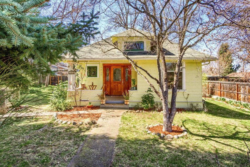 CUTE-CUTE-CUTE! This vintage 1908 true craftsman charmer with a comfortable covered porch, still has its original warm woodwork, built-ins and it is equipped with central heat, air conditioning and a tankless water heater. Very close to 3-acre, dog-friendly, Garfield park with a playground, basketball/volleyball courts & a seasonal splash pad for the kids. Also close to Southern Oregon University and just a level 1-mile to downtown Ashland, restaurants and the Oregon Shakespeare Festival. Go out the back door to the deck and enjoy your mornings, afternoons and evenings outside in this large backyard with a storage shed, flowers, mature shrubs and trees including Cherry & Dogwood. A great place for lawn games like croquet or badminton. The lot is zoned R-3 and has potential for an additional dwelling  (check with City of Ashland). Don't miss seeing this exceptional property.
