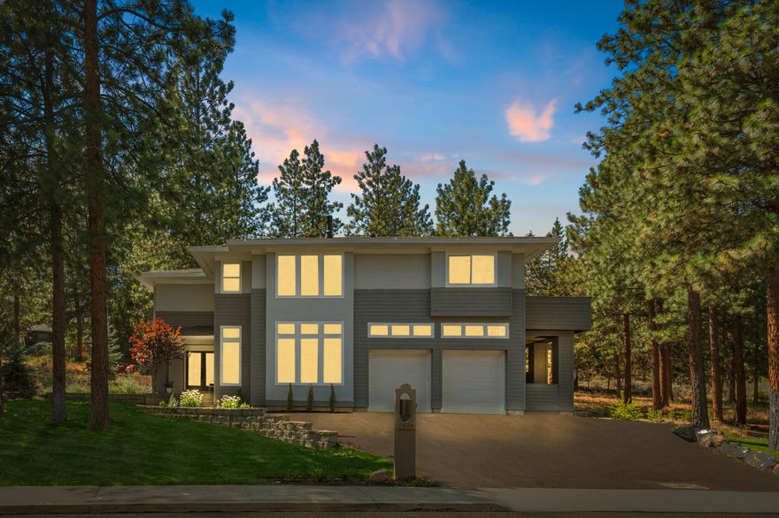 Nestled among the trees on Awbrey Butte, this stunning home offers a unique reverse-living design that maximizes natural light and beautiful vistas. Feel like you're living in a private treehouse with an open and airy main living space that seamlessly connects to a spacious deck—perfect for entertaining or relaxing in nature. The generously sized primary suite on the main level provides a serene retreat with guest bedrooms, bonus room and dedicated office on the lower level offering versatility for work and play. Situated on a large, level lot, this home features lovely landscaping, turf and a private hot tub for the ultimate outdoor enjoyment. Recently updated with warm and inviting finishes, this home is a perfect blend of modern comfort and tranquil surroundings. Don't miss this opportunity to experience the best of Bend living!