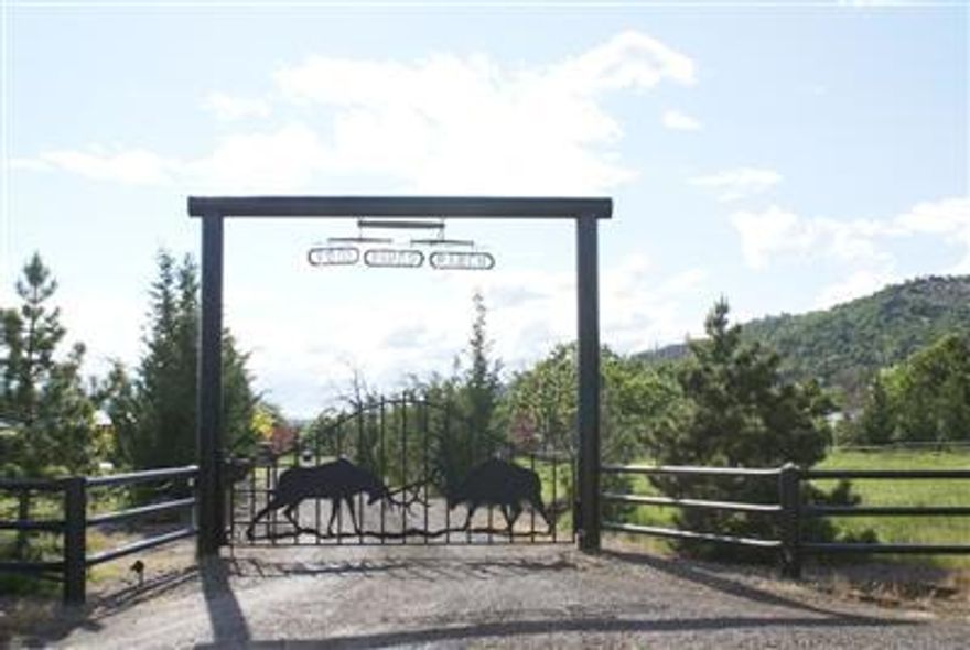 Twin Pines Ranch! 2 Custom Blt Lodge style Homes blue pine wood and Real plaster walls, Central Vacuum. Both homes have Full Garages, 1 Studio Apt. 321 Acres Aprox 68 Irr. Free water dated 1867 2 Horse barns 8 Stalls /w runs area for more stalls. 2 hay Barns feed barn.Large Covered arena 130 X 250 fully lighted currantly roping arena. Also machine shed Coolroom w/ meat cutting room. well 50+ Ga per min. . Main home has Inground Pool.Plus hottub off master.bed room. Large lawn with large gathering area for BBQs. Beautful raised bed gardens, waterfall and 2 RV Hookups. Backs to miles of BLM. Blacktail Deer, Elk,Bear & Turkeys live here. One Owner is Or. Lis. Broker