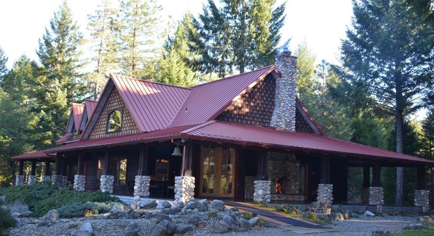 Stunning custom ranch home on over 40 acres with Munger Creek running thru it located in the Applegate/Williams Valley! The ranch style design features a floor plan that includes 3300 sq ft of living space and a beautiful covered wrap around deck to enjoy the outside rock fireplace. Views of the surrounding mountains, woods and pasture are truly breathtaking. The main level includes Master suite, gourmet kitchen with full service butlers pantry, office and guest bath. Living room consists of a beautiful floor to ceiling rock fireplace with window seating. The 2700 sq ft guest quarters has 2 bedrms, bathroom, greenhouse, shed & carport. The Equestrian's Dream includes a round pen, outdoor arena, 9 stall barn with auto-waters, hay loft, and a 4500 sq ft Pole barn. There is also a chicken coup & pig pen. Domestic water supplied by 75 gpm well & irrigation for 6 acres. There is so much to list you must view this property! All information deemed reliable, buyer to perform own due diligence