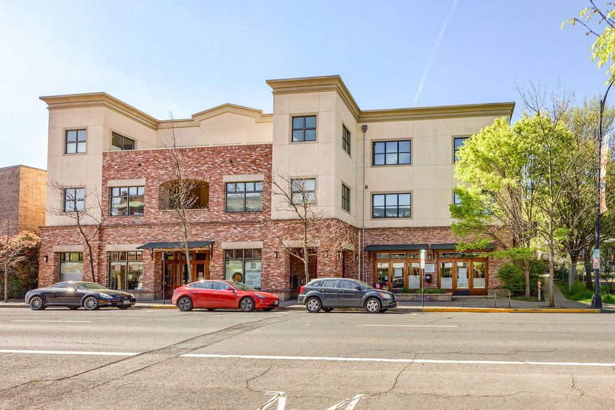 Elegant contemporary condo in the heart of downtown Ashland in the Jasmine Building.  1 bedroom 1 bath with a beautifully designed open floor plan and quality finishes - spacious kitchen with stainless steel appliances, solid granite counters, walnut floors, custom lighting, high ceilings. Lovely for entertaining.  Lots of natural light with 2 decks, city and mountain views. The bedroom has a soffit ceiling, and bath has custom tile floor and soaking tub. Secure access on second floor by stairs or elevator.  Wide hallways and doorways.  Single private garage with storage.  Perfect Ashland getaway or gracious downtown living year round.