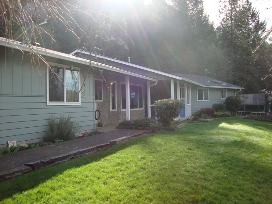 This Custom Built home shows pride of ownership, well maintained only 1 mile from down town Rogue River and I-5. This is perfect Country living on City Sewer, Natural Gas, and a great Well per owner,includes Grants Pass Irrigation as well. Home has been updated with New Roof,Heating/AC,Vinyl Windows, Remodeled Kitchen with Stainless Steel Appliances, New Master bath with tile shower and floors. Home is in move in ready condition. Beautiful Mountain Views with lots of room for hiking. Easy to maintain property with low maintenance.RV parking and paved parking area. This home has lots to offer including a 1 Bed 1 Bath, Living room that could be used as a Mother in Law unit with its own private entrance.