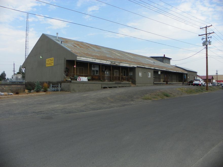 Nice large building with multiple tenants in the Enterprise zone.    Multiple use zoning allows for many commercial uses.  12 units & 10 tenants.
Current tenants, include office, retail, service, light industrial, manufacturing, and warehouse.  Great rental history with current tenants.  Basement has 12 foot ceiling and is rented as warehouse and used by owner. Three phase power.
There is approx. 6000 sf. of unleased and undeveloped space in basement and upstairs that could provide additional rental income.  Plenty of onsite parking plus additional street parking.  Great location with access to hwy. 97 & hwy. 126.  Property has hwy. 97 exposure that provides signage exposure for tenants.