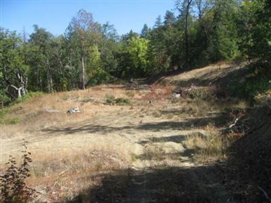 large level secluded pad already excavated for home, driveway in, septic in. Spring will need some further developing or new owner can drill well. Hillside so view is possible and has good view above existing site. Nice property for anyone wanting privacy, lots trees for years of firewood.