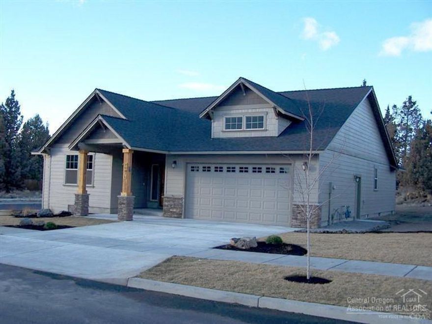 Gorgeous new construction on .23 acre lot. 3 bedrooms, 2 baths, massive great room with gas fireplace, knotty alder cabinets, slab granite countertops and island in kitchen. Hardwood floors and ceramic tile flooring. Master bathroom has both soaking tub and separate shower. Front yard landscaping with sprinklers included. Large RV parking area available alongside garage. Area of nice homes. Photos are of recently completed home. Call today!