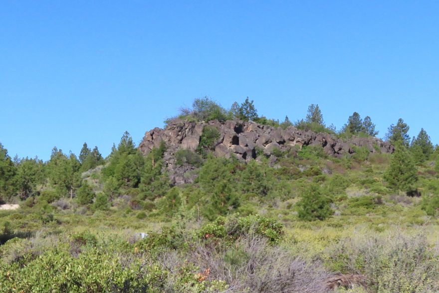 This rare premier half acre in the Heath neighborhood of Tetherow lot backs up to Tetherow Common space and overlooks the Deschutes National Forest. This lot is conveniently located near the heart of Tetherow with all the amenities of this world-class community. Access outdoor recreation right out the back door, with Phil's Trail close by. Don't miss this opportunity to build in Tetherow's best location. Golf membership included in full purchase offer with Buyer responsible for Transfer Fee.