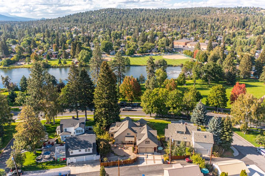 Seller offering $25k credit for closing costs or an interest rate buy down on this well appointed 3 bedroom home in the heart of Bend and at the epicenter of some of Bend's most iconic locations. Abundant windows and outdoor space allow you to enjoy the outdoors from almost any direction and the 1 bedroom ADU above the garage adds a 4th bedroom guest suite to the main home or allows for additional income opportunities as a rental. With a primary and office on the main level, 2 bedrooms upstairs, and the apartment above the garage, this house will offer flexibility for almost every buyer type. Outdoor living is at its finest with an enclosed yard, patio and garden, private hot tub deck, and wraparound front porch overlooking the majestic Deschutes River and Drake Park. Tending to the garden in the morning, grabbing your board for an afternoon paddle, or heading to the Tower Theater for an evening show; all of these are a part of the lifestyle that you should come experience yoursel