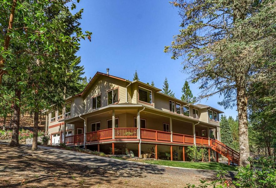Pass through the gate and on to your own private, enchanted forest bordering BLM land. The entire 61 acres have been made ''Fire-Wise''. For safety the fire road behind the house serves as an emergency exit if necessary. Beautiful pines, fruit trees and over 1000 flowering bulbs provide a sense of paradise all around you. 15 raised garden beds provide vegetables from Feb – Nov and the lovely stone patio has a soothing water feature. The property is completely self-sustaining w/4 large solar panels, an artesian well and generator fueled by a 500 gal propane tank with a gateway to automatically switch between grid and generator as needed. The lovely 4000 sq ft home has 4 bedrooms, an office, a hot tub room and a massage room. Hardwood floors throughout, a steam shower in the master bath is one of 3 baths. Lovely kitchen has granite counters, stainless steel appliances and a 6 burner propane stove. The recently added sunroom is a welcome place to contemplate the peacefulness of the forest