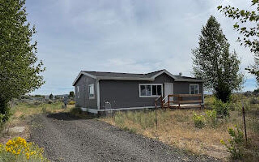 Updated double-wide home on spacious, shaded lot - Move In Ready!!  
Nestled on a level .31 acre lot, this beautifully remodeled double-wide manufactured home offers both comfort and potential.  With 3 bedrooms, 2 full baths, and thoughtful updates throughout, this property is ideal for anyone seeking peace, space, and a fresh start.  Step inside to find a refreshed home with new appliances, fresh interior and exterior paint, and a new roof ensuring peace of mind for years to come.  Relax outdoors on the newly built front porch, perfect for enjoying your morning coffee or the evening breeze.   This lot also has mature shade trees not only to enhance privacy and beauty, but to also create a tranquil atmosphere with their gentle rustling sounds.  Worth looking at!