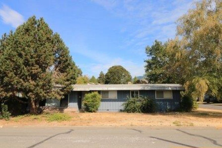 Opportunity knocks and it needs a makeover! This home is being sold as is and will need lots of work to call it your own, flip it, or rent it! This spacious 1770 square foot, one story, 3 bedroom home has classic lines and a great floor plan with living room, family room, dining area and open kitchen. In the heart of town on a big corner lot with all city services, close to schools, shopping and easy access to I-5. Cash buyers only please.