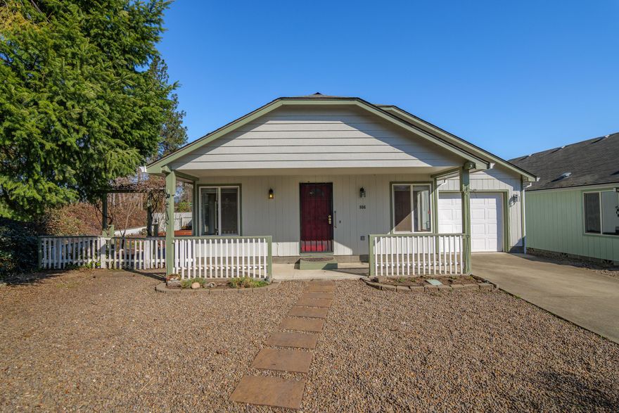 Welcome home to this cute end-of-the-road cottage offering peace, privacy, and plenty of space inside and out! This home features 2 spacious bedrooms, 2 bathrooms (including one with a walk-in shower/tub combo), and a vaulted ceiling in the living room that adds an airy, open feel. The galley-style kitchen boasts a pantry and flows into a cozy dining area, perfect for gatherings. Step outside to relax on the back deck or tend to your garden in the greenhouse and raised beds in the side yard. A wonderful retreat to call your own!