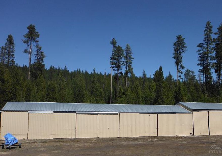 Owner will carry. DRASTIC reduction! This rare 5.36 acres located in the heart of Crescent Lake in the Crescent Pines neighborhood is zoned Residential and Commercial. Fenced Commercial area houses storage units, storage shed, office and house. The home construction was started in 1975 and never completed. Build your dream home nestled in the pines and your business.See aerial photo for view of treed parcel. Don't miss out on this one! Minutes from skiing, snowmobiling, fishing and more!