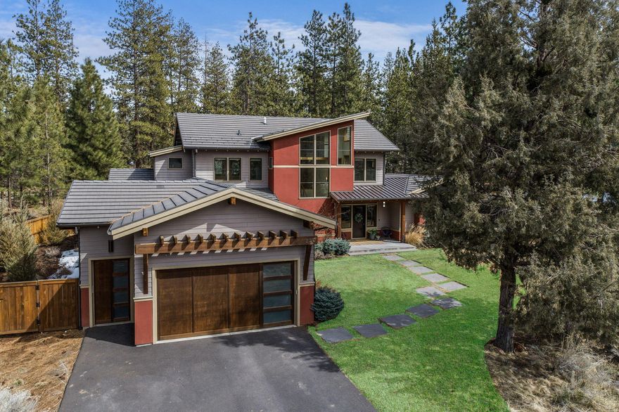 Stunning Northwest Contemporary in the heart of Bend's Westside! Built by award-winning Timberline Construction and situated on a private .53/acre lot adjacent to Overturf Park, this exquisite custom home blends quality craftsmanship, modern design and natural finishes throughout. Great Room features a striking wood-lined vaulted ceiling, gas fireplace, light-filled windows and access out to back patio and yard. Chef's Kitchen offers concrete countertops, professional grade stainless steel appliances, ample cabinetry, cork flooring and generous walk-in pantry. Spacious Dining area with access to covered patio for easy outdoor entertaining options. Main level also includes secondary Primary Suite, Bonus Room, office workspace, and convenient mud room/laundry. Upstairs: Primary Suite with private balcony, two walk-in closets and spa-like bath plus two additional bedrooms, full bath, and cozy reading loft. Excellent proximity to trail system and all Westside schools and amenities.