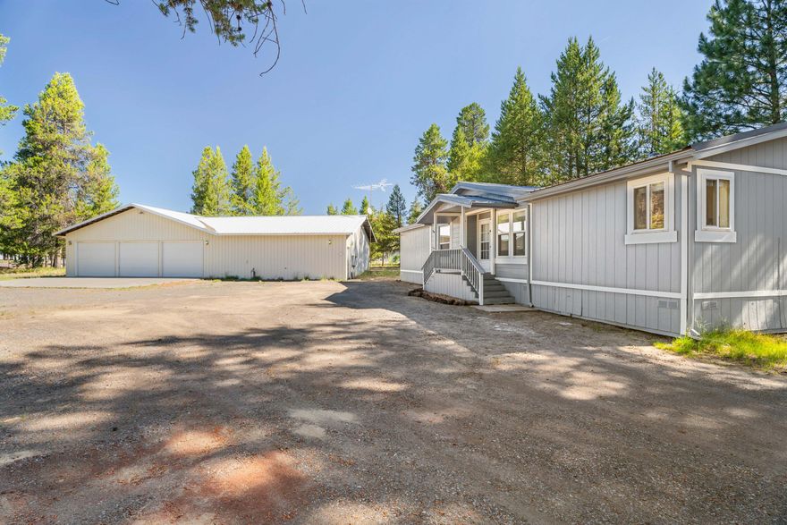 Back on market at no fault of the property or sellers! Have you been searching for a move in ready home with a shop off a paved road? Here it is! This 1400 sq ft manufactured home sits on nearly an acre and is fully fenced with secure gates, offering privacy and peace of mind. Recent 2025 upgrades include: fresh interior and exterior paint, a new metal roof, new waterproof vinyl flooring, granite countertops, updated light fixtures, and a new furnace that is heat pump ready. The true highlight of this property is the massive 30x66 shop—over 1900 sq ft in total —with 3 bay doors, 220 power, concrete floors, and an insulated workshop with an estimated 900 sq ft loft above. Perfect for projects, storage, & hobbies. Septic has been pumped & water results are in hand! This home is conveniently located near churches, local coffee & convenience store plus less than 10 minutes to the heart of La Pine.