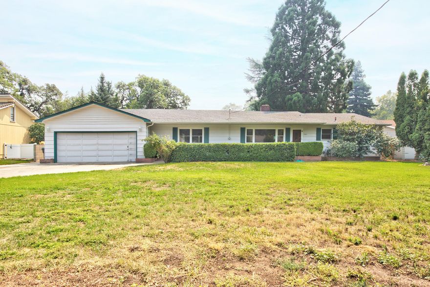 3 bedroom/2 bath home on almost half acre lot with mature landscaping in very desirable neighborhood between Medford and Jacksonville - the best of both worlds!  Split floor plan with spacious master. Gorgeous original hardwood floors and great floor plan just waiting for you to bring it to life again - tons of potential and a chance to own a home at a modest price in this fabulous neighborhood!