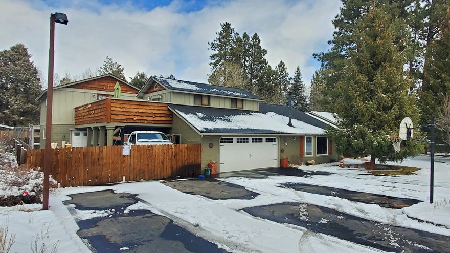 Wonderful Central Oregon two story home in SW Bend with unheard of 4 car garage with upstairs loft for your future needs on .39 Acres. Outside parking abounds including RV parking, huge yard, outdoor entertainment awaits you. Step inside to a spacious living area for all your friends and family with vaulted ceilings in living room with gas fireplace, Family room with wood fireplace, and  3 bedrooms with 2 baths on the main floor and 1 bedroom and 1 bath on the upper floor. Extras include fenced backyard, green house, stamped concrete patio, matured landscaping with minimum maintance, she shed and he shed and so much more! Close to great schools, the fabulous OLD Mill, shopping and easy access to HWY97.  Waiting on Professional pictures but can show NOW!! Sellers are ready for an offer!