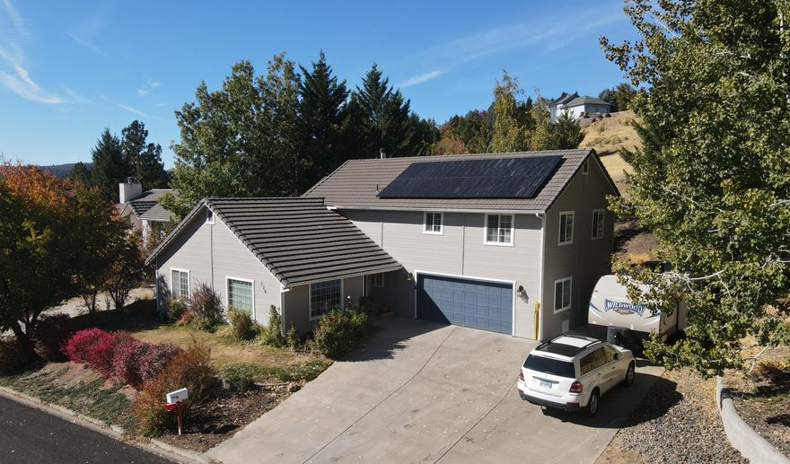 This Very Clean And Well Maintained Soyland Built Home Holds Over 2500 Square Feet, 4 Bedrooms and 3 Full Baths. The home has a Hillside View Makes Hiking, Walking And Outdoor Activities Very Convenient And Right Across he Street. The Floor Plan In This Home Is Convenient And Well Laid Out. Separate Family Rooms Perfect For Entertaining Or Family Time.The Large Kitchen Also Has A Breakfast Nook Or Additional Space For Dining. The Grand Staircase Leads To The Huge Master Suite And 2 Great Sized Bedrooms. The 4th Bedroom Is On The Main Floor With A Full Bathroom. New Interior and Exterior Paint On Most Of The Home And A Lifetime Tile Roof For Very Low Upkeep Costs. Front And Backyard Landscaping Is Low Maintenance With In Ground Sprinklers RV Parking Can Be Found On The Side Of The Oversized 2 Car Garage.
Newly installed Solar Panels
Listing Agent is related to seller