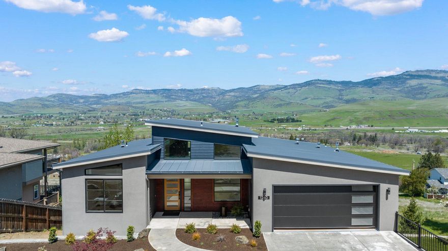 Enjoy breathtaking views of Grizzly Peak as you enter this 4BR + office, new-construction, contemporary home. The striking, angular roof lines create dramatic 14' ceilings in the combined living/dining/kitchen area. Large windows offer abundant light throughout the entire home. Every room in the house has a magnificent view. Chef's kitchen with granite and quartzite countertops, island, and high-end appliances. Single level living is possible with 2 ensuite master bedrooms, kitchen, and laundry on the main floor. Lower level offers 2 additional bedrooms plus office, 2nd common area and full bath. 2,367 total sq. ft. Enjoy the professionally landscaped front yard and outdoor living on the 2 back decks. Home built with attention to detail at every turn. Potential to develop an additional 430sq ft Accessory Residential Unit with a separate entrance (to be permitted and finished by buyer, at buyer's expense), or create a home gym, wine cellar, workshop, or media room.