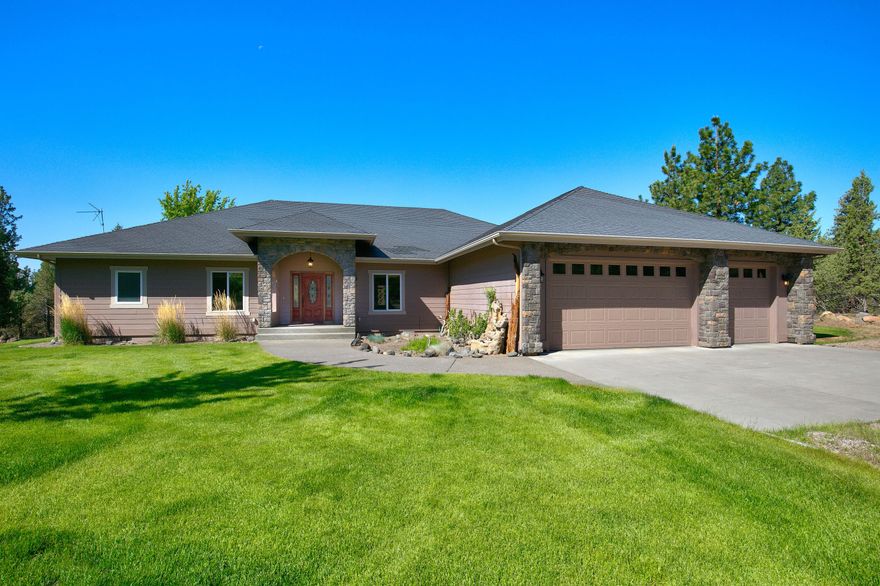 Sisters SINGLE LEVEL home on 37+ acres with a 3-CAR garage and views towards the Cascades. Open great room with vaulted ceilings, stack stone gas fireplace, and Brazilian Tiger wood floors. Kitchen with island, gas stove top, wall oven and convection microwave, trash compactor, walk-in pantry and tile counter tops. There is a dining area with room for a large table along with a dining nook. Master bedroom is separate from the other guest rooms and has a walk-in closet. Master bath has tile floors and counter tops, dual vanities, tile shower and a jetted tub. Den/office and an exercise room. Central Vac, Air conditioning and ceiling fans. Large patio and manicured lawn. Garage has a heater and sink. There is a 1440 square foot RV garage/shop with hot water tank and sink, lean-to with 4 horse stalls and a separate driveway. 36.27 acres are enrolled in the Wildlife Habitat Conservation Management Program. Private well and cistern.