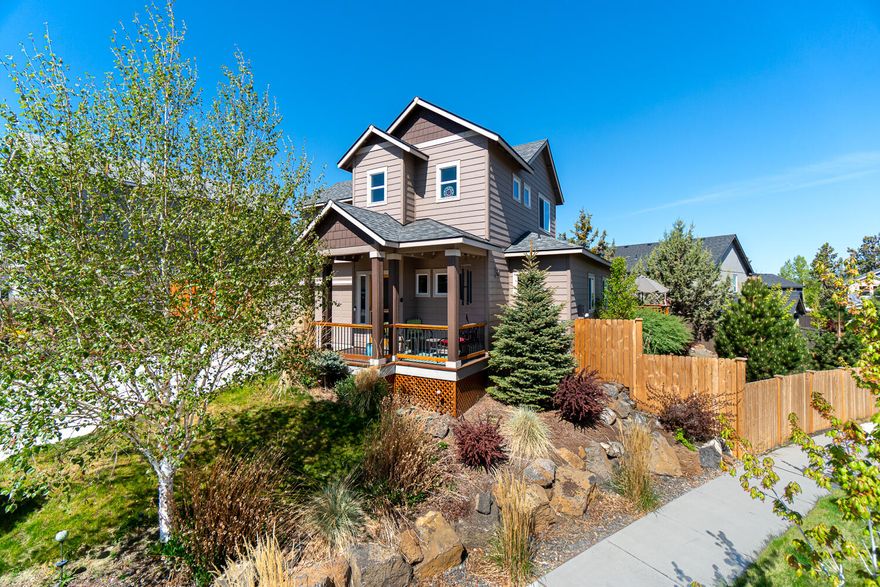 Immaculate home on corner lot nestled in the quiet Southcrest subdivision in NE Bend, just min to the parkway, Cascade Village Shopping Center, & downtown Bend. Inviting entry w/ half bath leads to an open floorplan w/ desired primary bedroom downstairs. Kitchen ftrs laminate flooring w/ large central cooking island w/ hood, breakfast bar seating, tile counters, & lg pantry w/ extra storage. Main living area is carpeted w/ vaulted ceilings, beautiful stone surround gas fireplace w/ mantle, sliding doors that lead out onto the side deck & yard, plus peekaboo mountain views from one of the main windows. Primary bedroom ftrs a walk in closet & bath w/ dual vanities, a soaking tub, & step in shower. Upstairs you'll be greeted by an open loft area, two other large bedrooms as well as a full bath. Laundry is located downstairs off the main living area w/ built in storage & leads to the double garage which features built in cabinetry too!Upstairs used as short term vacation rental. Don't Miss