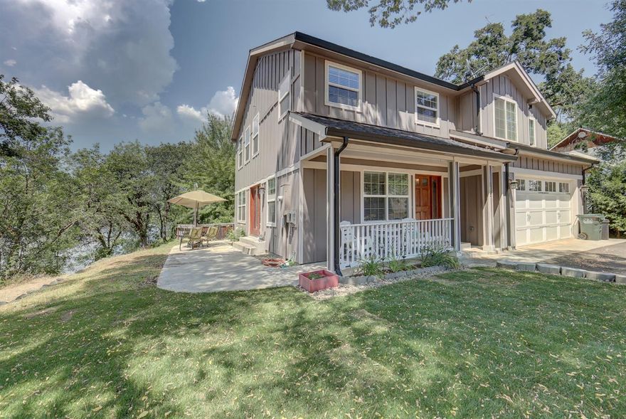 This Classy two story home was built to enjoy views of the river, but without the high river taxes. This home is located in the prestigious Cove and shares a common area and road system with access to 1000' of ROGUE RIVER FRONTAGE to fish, picnic and play on. Built in 2005, quality amenities include hardwood & tile flooring, custom cabinetry, walk in kitchen pantry, solid wood doors throughout, two fireplaces, and lots of windows for natural light and taking in the beautiful views. Open living-dining room with french doors lead out to a large patio for outdoor barbecues and entertaining friends and family. All bedrooms are up and oversized including a luxurious master bedroom suite with walk in closet, large bath with double vanities, jetted tub, and separate shower. Indoor utility room and a finished double garage finish off the package very nicely. Enjoy the lifestyle of living in the Cove with dues of only $100 per year. This home won't last long!