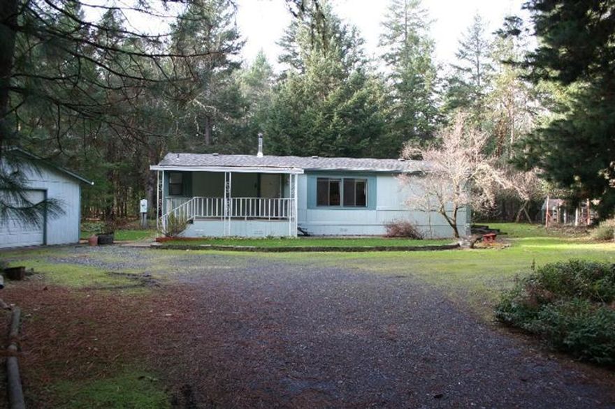 Very nice home in the country yet close enough to town. This is a top of the line Marlette manufactured home on 2.93 wooded acres The home is a three bedroom, two bath. It has new paint inside and out, new carpet and vinyl flooring. Had a 30 year roof put on it in 2010. Property is completely fenced and has a separate fenced garden area. Home sits back off of the road on a flag lot for a nice private setting. The garage is a nice sized detached and is 24' by 30'with a lean-to on the back side and a pump house on one side. Also has a 10' by 13' storage shed and a covered portable car shed. Has a nice covered front porch and another one on the back of the house and a patio for barbecuing. Comes with some fruit trees, cherry, a;;les and plums. This property is about a mile from the Rogue River and Griffin Park for easy access to the river. One seller is a licensed Real Estate Agent in Oregon. All Information is deeped reliable, but not guaranteed, & is subject to change.