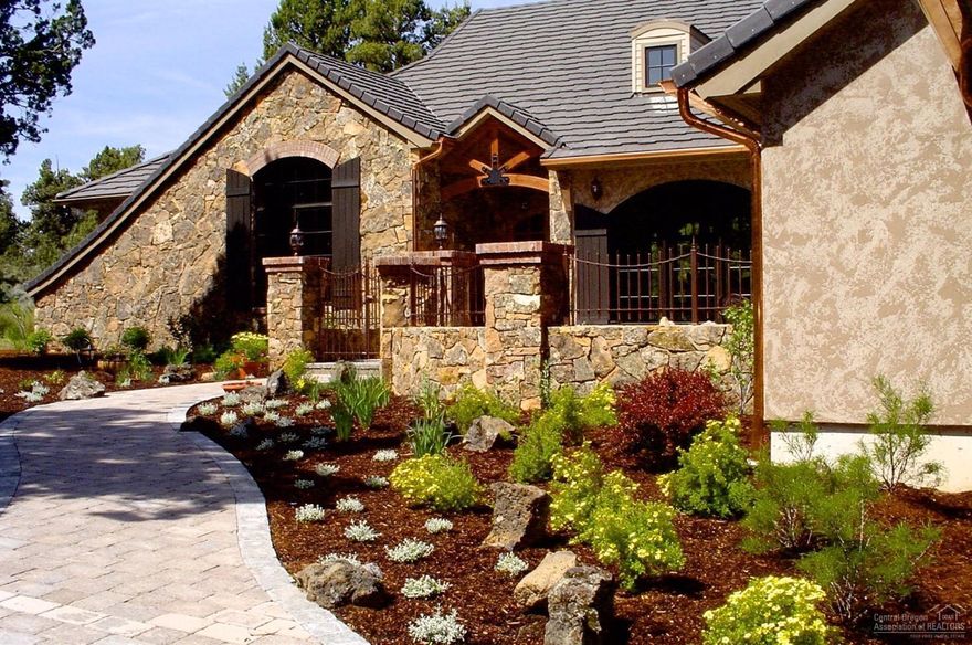 Beautiful NW Style - French Provincial, Mtn. View, Steven Van Sant designed home built by PacWest. Single level, 3 BRs + office. 16 foot ceilings, wood beams, double sided stone fireplace, solid wood doors, large, open kitchen, slab granite counters, wide plank, cherry, hardwood floors, slate & travertine, radiant heated floors plus heat pump A/C that is Dual Zoned. 2 indoor/outdoor dog kennels with radiant heated floors! A bonus room is above the 3 car garage. Large pond & privacy, backs to Tumalo S. Park.