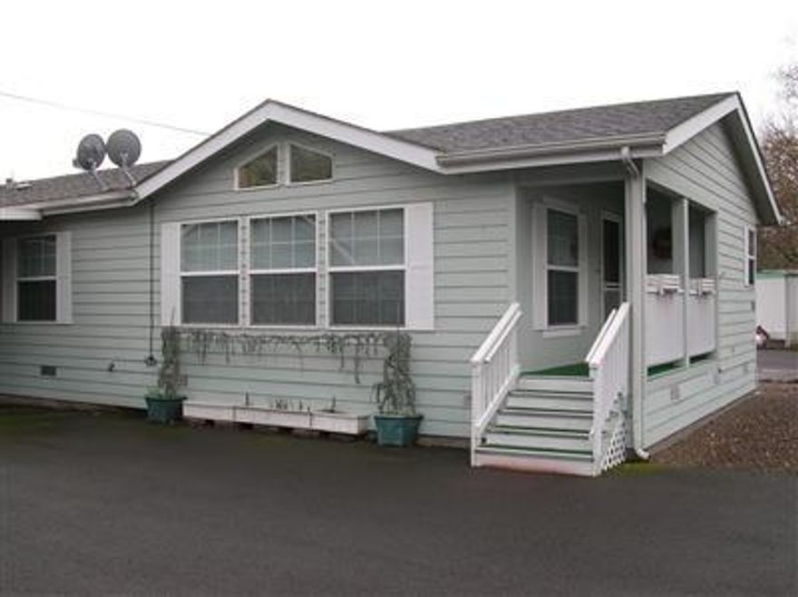 Absolutely immaculate inside & out! Ready to move into. Oversized two car garage w/heat & RV parking. Top of the line manufactured home w/vaulted ceilings, lots of windows & gorgeous layout. Hi-end drapes, french doors lead to a nice office w/built-ins. Almost all new appliances, instant hot water tap, pantry & island in the kitchen. Real kitchen cabinets, skylight & ceiling fans in every room. The master bedroom has a walk-in closet, tub & separate shower, oversized utility room w/2nd pantry, paved drive & breezeway. Hardi plank siding & EZ care landscaped.