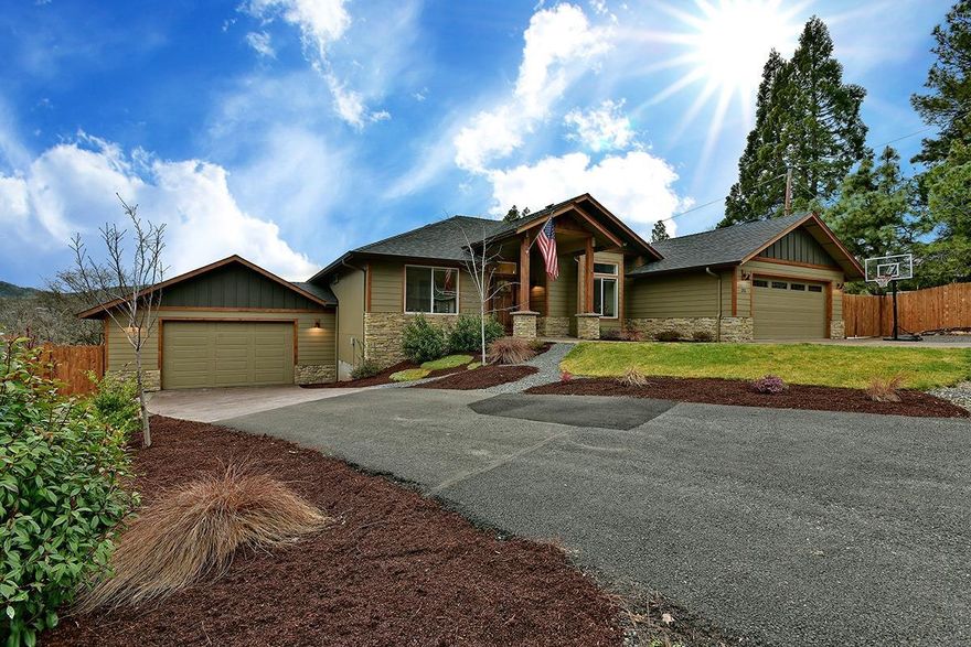 4bed, 2bath 2196 sq.ft. home has a 2 car garage & additional attached 2 car shop that includes an extra 400 sq.ft. of living space (bed,gym,home office), complete w/closet, vanity, HVAC. The spacious living room has hardwood floors, gas fireplace, vaulted ceilings & opens onto the large back deck w/beautiful mountain views w/ plenty of room for entertaining. The kitchen has stainless steel appliances, gas cook top oven, dishwasher & garbage disposal & Lg stainless kitchen sink. Hardwood floors, granite counter tops w/ bar, plenty of cabinets for storage & Lg pantry off of kitchen. It is complete with a breakfast nook that overlooks the valley. Hardwood floors throughout the home with carpeted bedrooms and solid hardwood doors. Split floor plan, with a Lg master-walk-in-closet & barn door bathroom entry. Laundry room has extra storage and finished garage includes a mud sink. Landscaped front & back yard, in-ground sprinklers, 2 multi-level back deck w/composite decking. RV parking.