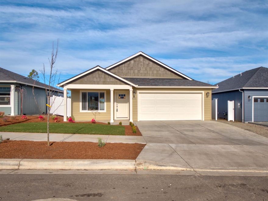 Want a brand-new home but can't wait 6 months to built it? This completed single-story home in SW Medford is conveniently located just minutes from downtown Medford, I-5 access, shopping, schools & medical facilities. The floor plan is a perfect transitional style featuring 3 bedrooms and 2 full baths in 1,413 sq ft (per builder). Standard features in include vaulted ceiling, 6-inch premium plank flooring, vinyl fencing, and front & back yard landscaping with timed sprinklers. Laundry room and both baths feature ceramic tile flooring, and the kitchen features custom cabinets, granite or quartz counters, upgraded stainless steel appliances with gas convection oven, and eat-in bar. The 2-car attached insulated garage is fully finished and painted, with garage door and opener. Enjoy the nice mountain views to the south from the front porch. Listing agent has an ownership interest in the LLC that owns the property. Must see!