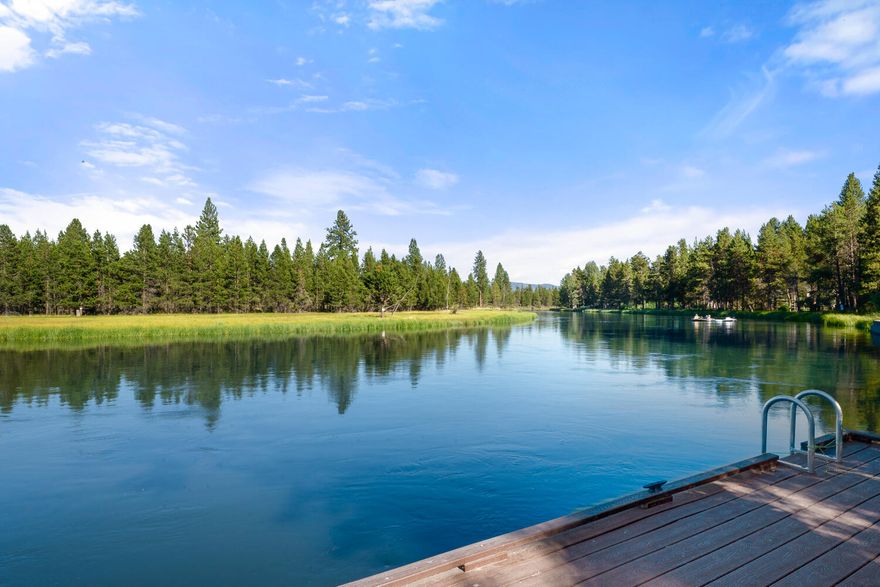 Rare riverfront gem with a grandfathered-in dock—paddleboard, kayak, or canoe right from your backyard! This custom 4-bedroom home sits on a serene and private half-acre, surrounded by nature yet close to Sunriver, Bend, La Pine, Mt. Bachelor, golf, and endless trails. Relax by the river with deer, elk, otters, and soaring birds of prey. Inside, the newer furnace along with the cozy wood stove keeps you warm in winter, while A/C offers year-round comfort. The main-level primary suite provides convenience, with three more bedrooms upstairs for guests or family. Ideal as a primary residence, vacation getaway, or short-term rental. Just 10 minutes to Sunriver and under 20 miles to Mt. Bachelor—outdoor recreation is never far.  Home was completely remodeled in 2012, newer HVAC, septic and well make this home move in ready and low maintenance for years to come!