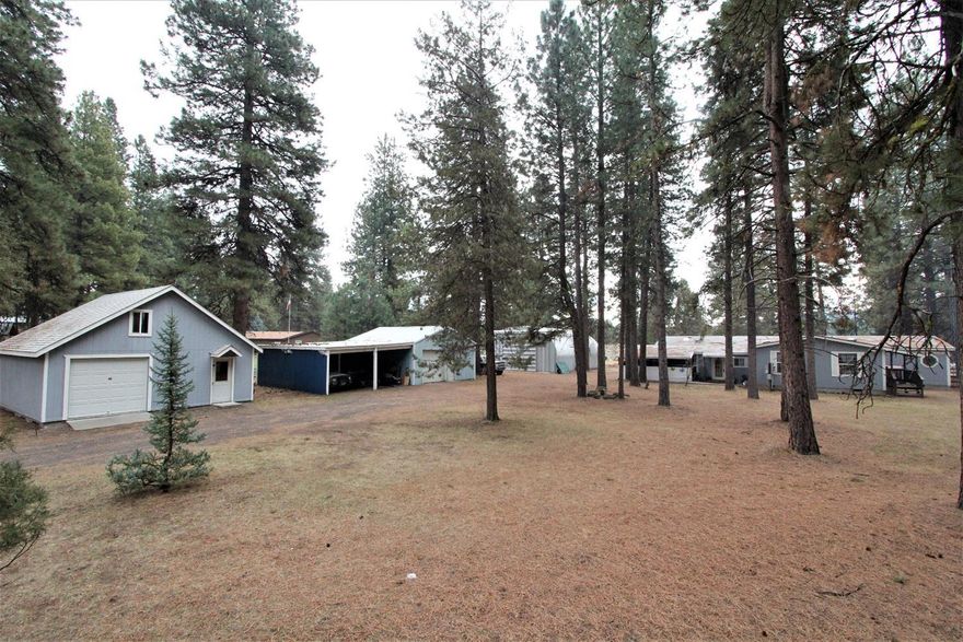 2 Master Suites in this 3 Bedroom plus office or bonus room, 3 Bath 2536 sf MH on 1.16 acres in Keno. Bring your projects, toys and plan a STAY-CATION in this home nestled in the pines with excellent views of Klamath River. Huge SteelMaster building is appx. 1500 sf. Additionally, there are 2 - one car garages with shop space, storage and carport. Home is handicap accessible and has an office, family room, living room, vaulted ceilings, open concept kitchen, and a mud room. Lots of natural light from large windows and sky lights. Entertain or relax and listen to nature while soaking in the river view on the covered deck with custom touches and a fire pit. This is a must see, too many great features to list them all.
