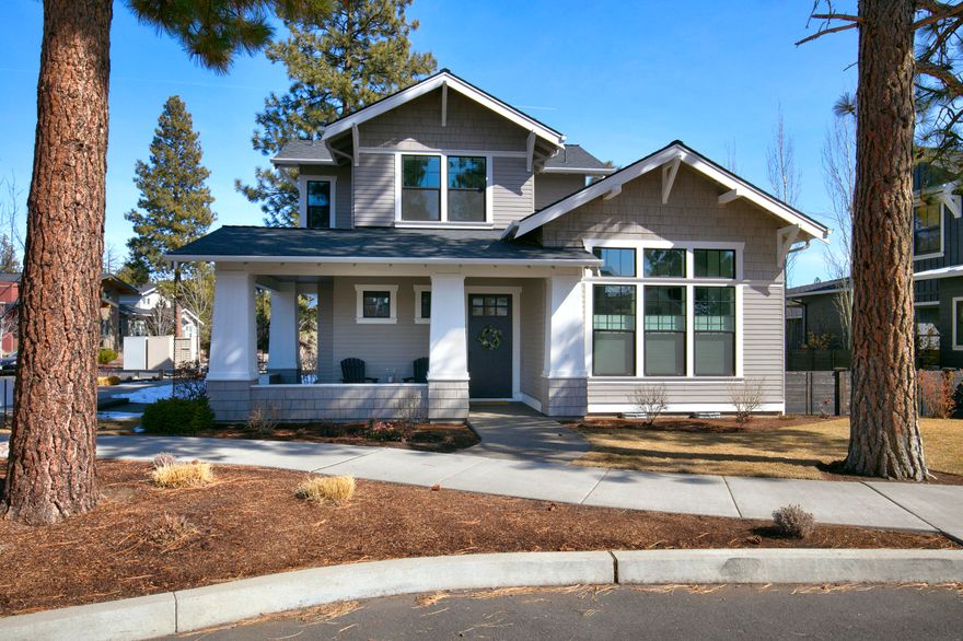 This former Tour of Homes champion, located just four houses away from Discovery Park, is impeccably maintained and boasts numerous amenities. Built by Structure Homes with a focus on energy efficiency. The main level hosts the primary bedroom, while the second floor features two additional bedrooms, a bathroom and a bonus loft with a bar area. The open kitchen boasts stone counters, a large pantry, and overlooks the living room with a fireplace, as well as the dining room with built-in buffet and double sliding doors leading to the covered patio complete with recessed lighting, skylights, a fan, and a television - ideal for year-round entertaining. Other notable features include triple pane window, dual opening cordless blinds, soft touch drawers throughout the entire home, a private corner lot, stunning hardwood floors, modern bathrooms with high vanities, heated marble floors in the primary bath. A powder room is conveniently located on the first floor. Wrap-around front porch!