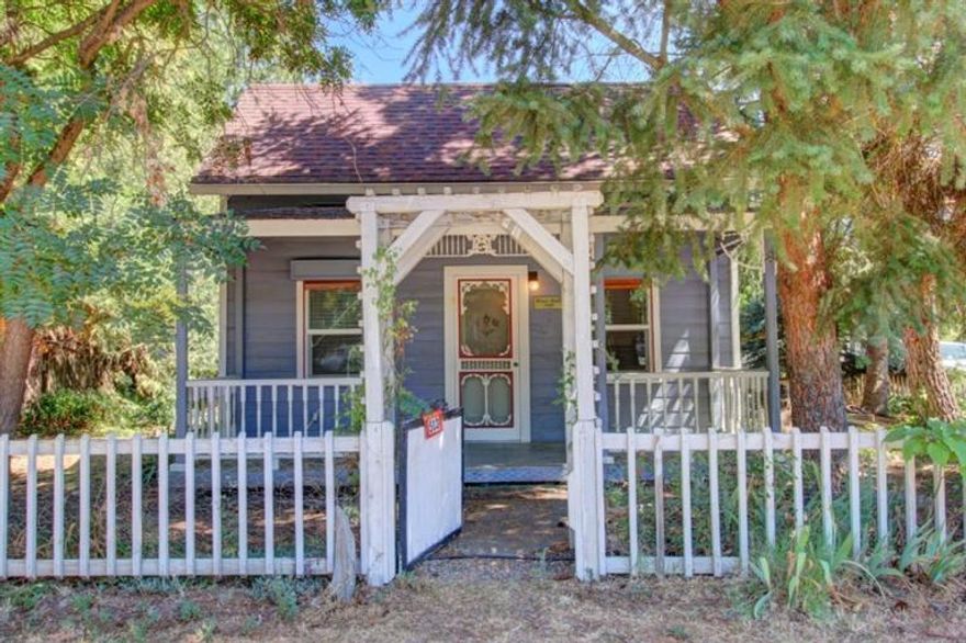Incredible Value Here! Charming & adorable vintage home w/big covered front porch. Some updates were completed in 1998 including: New forced air gas furnace, roof, electrical, kitchen cabinets & appliances, int & ext paint, laminate flooring, light fixtures & window hardware. Nice sized living room & master bedroom. Wonderful double bath. Small 2nd bedroom has been converted to one larger kitchen. Square footage includes 190 sq.ft. bonus room upstairs. Could be 2nd bedroom. Small shop w/220. Deep carport & additional secured storage room. Unique window security system.