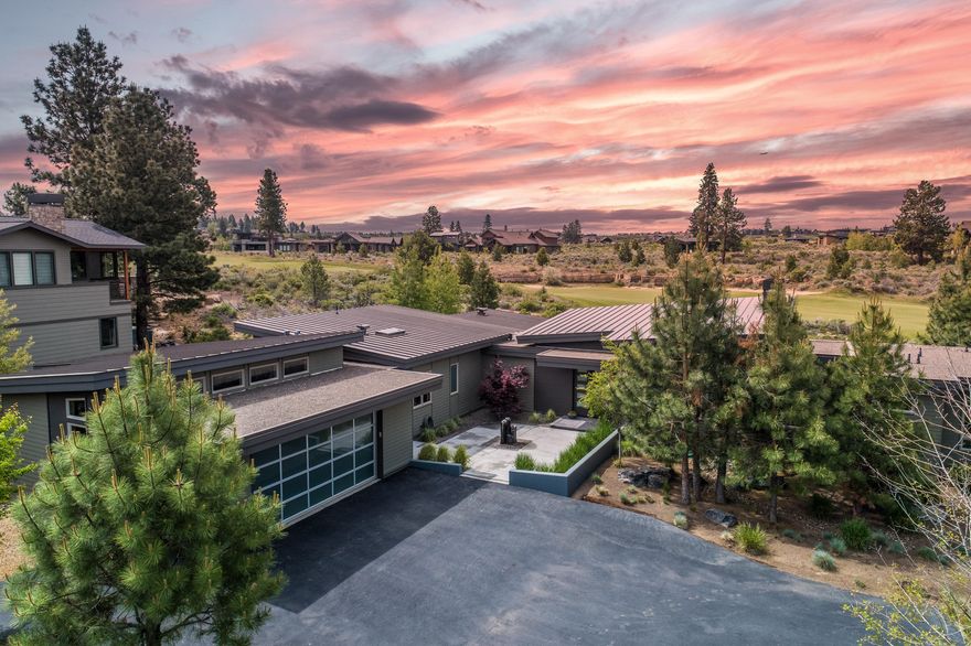 From the moment you walk through the front door, this contemporary designed BendTrend home you will be captured by its spectacular views of the 13th fairway at Tetherow and Mt Bachelor and its beautiful gourmet kitchen with large island, breakfast bar, high end appliances, and large pantry with bar.

Other highlights include a spacious family room; a large master suite with sweeping views; a fitness room (or office); and a tandem three car garage with plenty of storage, radiant heated floors, and an indoor/outdoor kennel. 

Outside you can enjoy the hot tub, large grass area with room to run and play games, and kids (young and old!) can play on the in-ground trampoline. The backyard is wired for an electric fence system (previously Invisible Fence but can be used for other systems)

The home is certified Earth Advantage Platinum and designed to be extremely efficient and full of light. It features 8-inch exterior walls, 14-inch insulated ceilings, radiant floor heat, and LED lights.