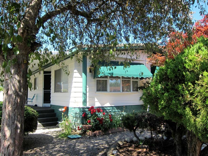 CATHEDRAL ceilings, view of the lakeside fountain, large formal living room, open kitchen...what more could one ask for this at this price. Shed is included and provides for a double carport. RVparking within the complex. If you are thinking of downsizing and traveling this is the place to buy. Small well kept yard has been maintained for years by a master gardener and he is still available to meet your needs. 55+ community so age restriction applies. Home is on leased land and rents for $560/month including water, sewer, and garbage. The rent is comparable with other mobile parks in the area and is located steps from the Rogue River. Just 10 minutes to downtown historic Grants Pass