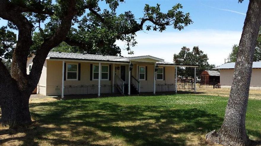 Neat and clean 3 bed, 2 full bath double wide with many upgrades, 2 yr old roof, 2 yr old appliances, new heating and air systems, new carpet & vinyl, new paint inside and out, new double pane windows, front metal awning, RV sewer service, all this in 5+ cross fenced level acres, plus a 2000+ sq ft shop with 2 garage doors separate electric meter, good well per seller with UV light, home sits back from road for comfort with two driveways, lots of room for someone that is looking for a place to park their own semi. After Jackson County Surveyor approves new lot line on lot #1800 total acreage will be approx. 4.88.