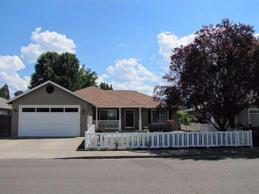 Beautiful home in South Medford area with lots of pride in ownership! Lots of updating that includes a ton of attention to detail in the front and backyard. New white vinyl fencing in front yard and backyard recently updated with built-in fire pit that is run on gas. Beautiful patio all recently done in pavers along with 2 water features. Patio has gas hook-up for BBQ and extra storage shed. Drip system for planting in front. Nice master bedroom with his and her closets along with dual vanity sinks in master bath. Includes a breakfast nook and formal dining area and also spacious living room. Sink in laundry. Skylight in guest bath. Lots of storage throughout! New gas 50 gallon hot water heater. Pull down ladder in finished 2 car garage. This home is a must tour!