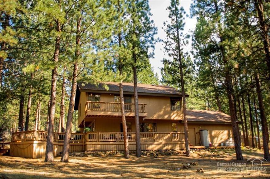 Desirable Woodside Ranch contemporary home (2156 SF 3bd/2.5ba) plus guest cottage (576 SF 1bd/1ba) sits on a pristine and private 2.6 acres. Enjoy the privacy of the large Ponderosa pines from the expansive deck. Long paved driveway leads to an oversize 2 car garage & gated boat / RV parking. High end built in desk for a home office. A large portion of the backyard is fenced with 4' horse fence. BLM land / miles of trails is only 2 blocks away. The quiet and privacy this property offers makes it a must see