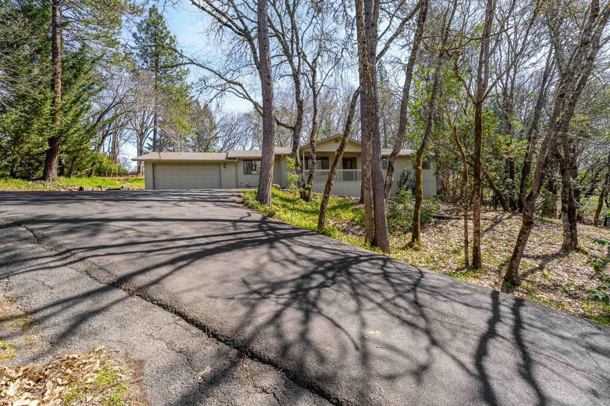 Peace and serenity awaits! Wonderful single owner home has been meticulously maintained + lovingly cared for over the years and features a BRAND-NEW heat pump. It sits on a beautiful 1.25ac lot in the prettiest nature setting with spring blooms and trees that offer an abundance of privacy. You will be greeted with pride + ownership that shines from the inside out! This home is as clean as can be, with a light, bright and open floorplan. It boasts a huge inviting living room space, two dining areas and a spacious kitchen with tons of cabinets/storage. There are 3 bedrooms, as well as an enclosed bonus or hobby room off of the garage. Enjoy the shaded and expansive back deck perfect for entertaining + hosing summer BBQs. Plenty of level parking in the back of the property and perched up from the road with peaceful views in all directions. There is also an enclosed garden area ready for your summer veggies. Desirable area + minutes to town- don't miss out on this lovely home!