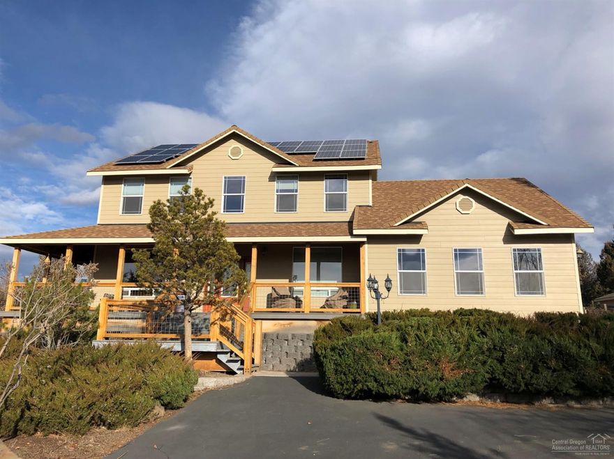 Cascade Mountains surround this custom home on 2 sides with a wrap around Trex Deck and private rear, covered patio. This 4 Bedroom plus office, plus large upgraded kitchen with slab granite counters, plus additional family room with wood vaulted ceilings, hardwood floors, 2,508 Sq. Ft. Home sits back off this quiet street and backs to almost 2 acres of Common Space including a common strip off the east lot line. The front of the property has a fenced Horse Area with a Large Loafing Shed, a 1,296 Sq. Ft. Large Shop with an RV Bay and 2nd Auto. or trailer bay besides the attached garage and paved driveway. The Rear has a terraced Garden Area, a Greenhouse near the shop plus an enclosed storage shed & Solar added to home. Plenty of additional parking areas. Nearby is Steelhead Falls, Foley Waters & both the Deschutes River and Crooked River Trails. This private setting, beautifully built home has all you need to live the Central Oregon Dream.