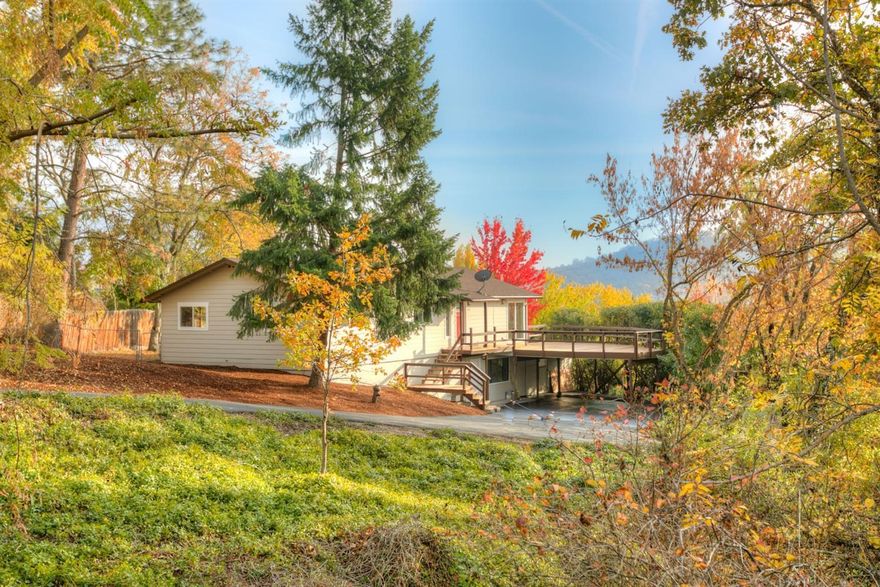 So many hard to find features, upgrades, and so much opportunity at this amazing E Medford Home. Extensive updating, 2 family layout, in ground pool, views and a huge lot are some of the major attractions. The 4 bedroom, 3 bath home is like new; totally renovated with updated kitchen, stainless appliances, updated bathrooms, hardwoods, fixtures, windows, designer paint, roof, siding, decking, fencing and more. No expense was spared to make this home turn-key, move-in ready! The main level contains the primary living spaces while the lower level offers a 4th bedroom, full bath, family room and private entry; perfect for a 2-family setup or extra space that every family can enjoy. The .68 acre lot can be split, or add an ADU or shop, a great opportunity for a Contractor or investment for any buyer. A paved drive to the private home setting, tons of room for toys, fruit trees, grape rows and mature landscaping, this property has it all!