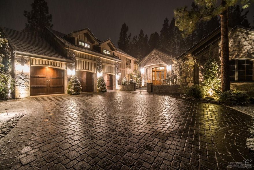 Fabulous custom home in beautiful Broken Top! This unique gem is 5818 total sf with gourmet kitchen, Travertine floors, freshly painted interior and exquisite details throughout. An entertainers dream includes bar room, wine cellar & theater room! Open beamed ceilings, 3 car garage, private guest wing, & stunning entrance. Cook your favorite meal in the outdoor kitchen overlooking the 12th Fairway. Enjoy a glass of wine by the fire or water feature in the private outdoor living space. A must see!