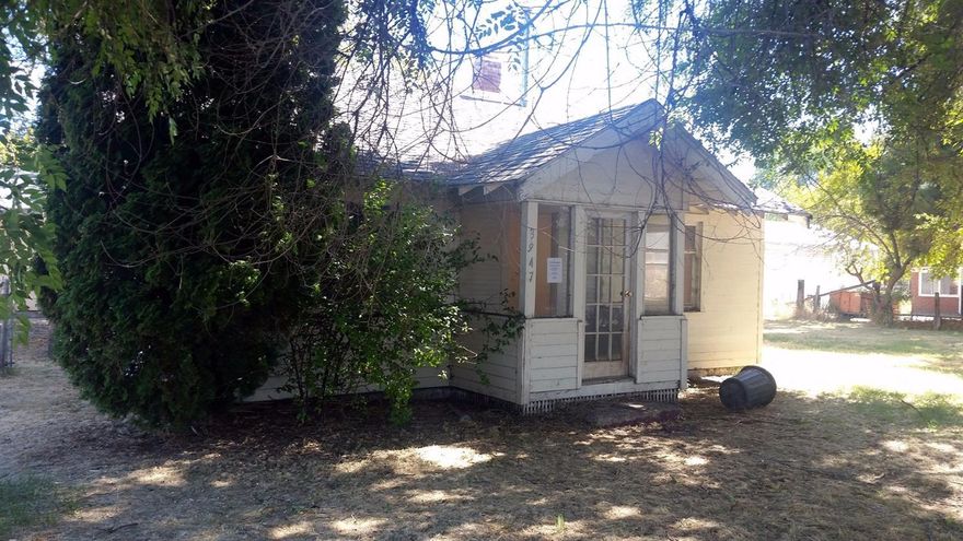 The possibilities are endless with this property. Cute house that needs someone to see its potential. Jack and Jill bathroom, nice sized kitchen, separate utility room. Oversized two car garage with a separate work space with bench. Almost an acre of fenced land with mature trees, including some fruit trees.Brand New Gas Heater & New Hot Water Tank