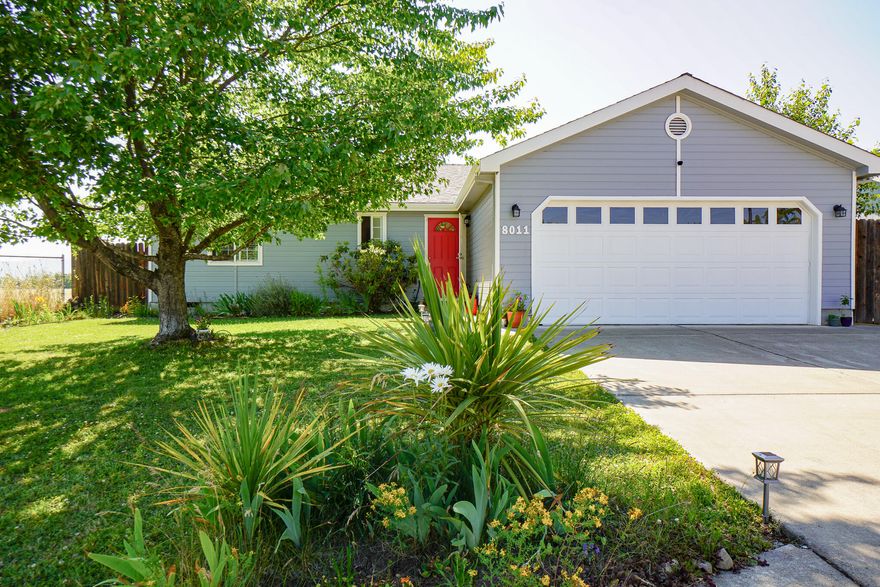 Well maintained lovely home with high vaulted ceilings, open floor plan, and lots of storage. The dishwasher and water heater have recently been replaced as well as many of the light fixtures in the home. The exterior has fresh new paint and the landscaping is mature and lush with lots of plants and flowers.  There is a large covered patio,  perfect for relaxing, and a dog run. Ideally located at the end of the street next to county owned property which is great for walking and privacy. Home is conveniently located near amenities including library, sheriff's office, and playground. The seller is also providing a one year home warranty for the new purchaser.