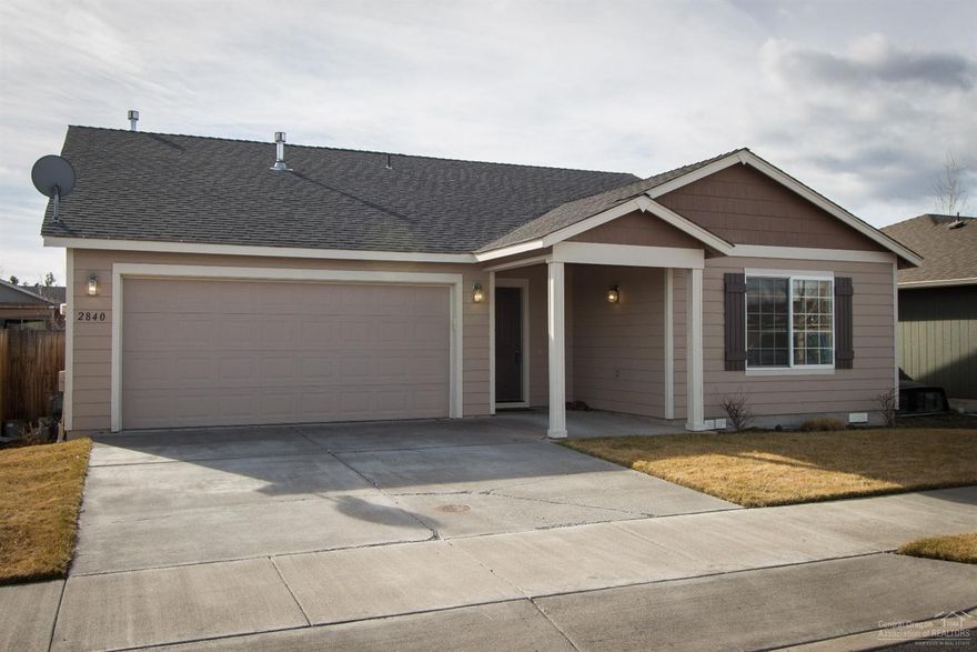 Attractive ranch style home with all the essentials in a quiet residential neighborhood several blocks north of Highland Ave. on the west side of Redmond. Deep covered entry, vaulted great room, island kitchen w/ breakfast bar. Wood flooring in DR and kitchen. Ceiling fans in great room and master BR. Slider in DR leads to paver patio in large fenced back yard. Wall cabinets in laundry room. Gravel pad for RV or boat parking inside gated fence beside double attached garage. W/D, refrigerator included.
