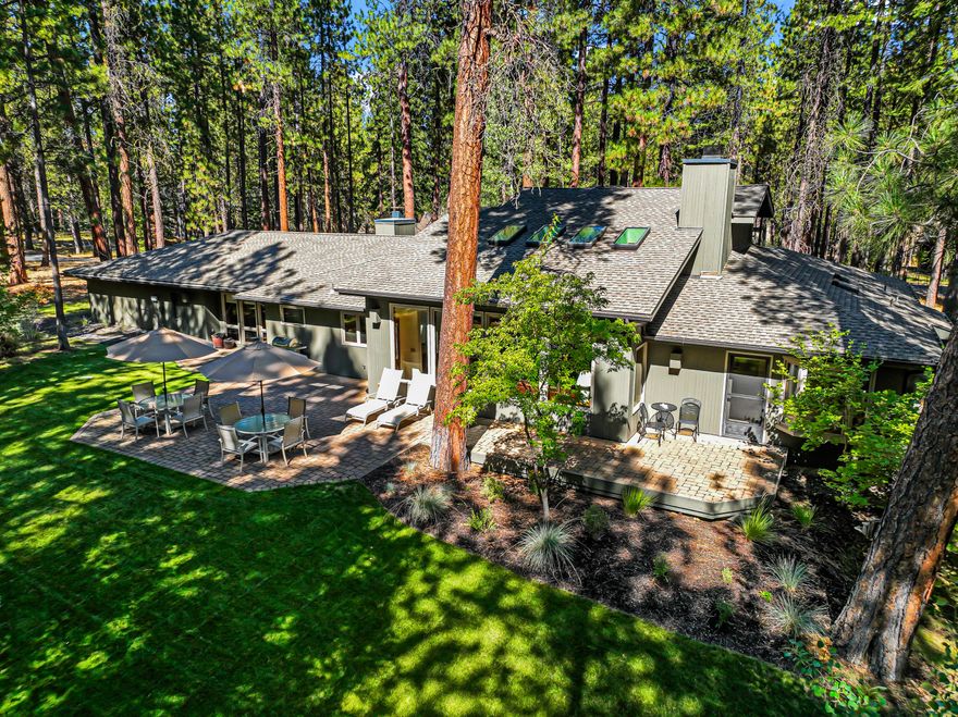 This beautifully landscaped home sits on over an acre with views of the 14th tee at the Glaze Meadow Golf Course and is just a block from the Upper Glaze Meadow Pool Complex. Designed for mostly single-level living, it features an open floor plan with a spacious kitchen, dining area, and great room with wood-burning fireplace. The main level includes three bedrooms, three full baths, a large family room, laundry, and flex space. Upstairs, a generous loft offers additional space for guests, entertaining, or relaxing. Outdoor highlights include a paver patio, sprinkler system, and paved driveway. Recent improvements include a new HVAC system (2021), new skylights, and fresh paint. Whether you're seeking a full-time residence or a peaceful vacation retreat, this home offers the perfect blend of comfort, space, and location in the desirable Black Butte Ranch community.